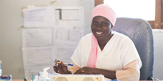 Healthcare worker at her desk in local clinic in Louga region