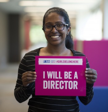 Youth holding sign saying I will be a Director