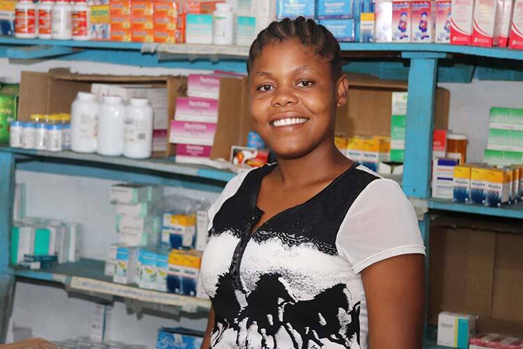 Woman standing in front of shelves filled with medical supplies.