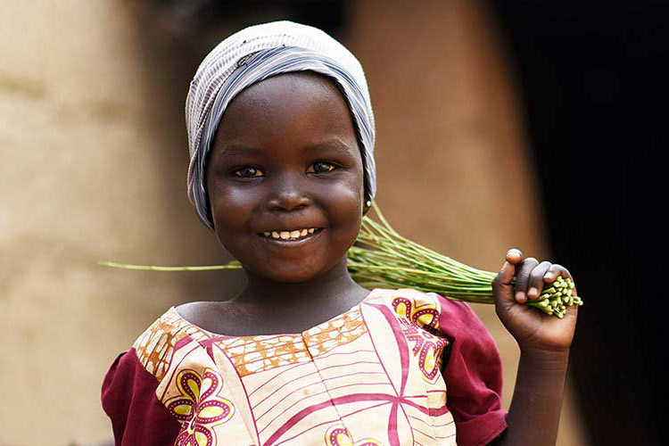 Smiling girl at her home in Maiduguri IDP camp 