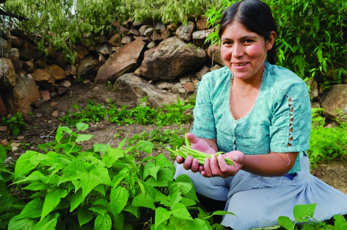 Ana-tending-to-her-crops-700x464