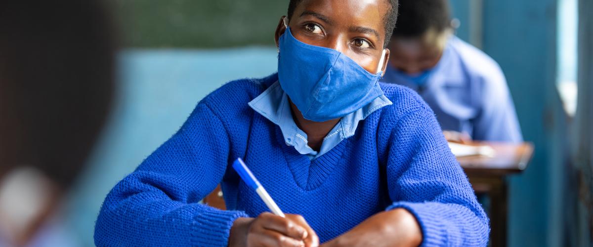 Girl learning in classroom at secondary school in Mwenezi district